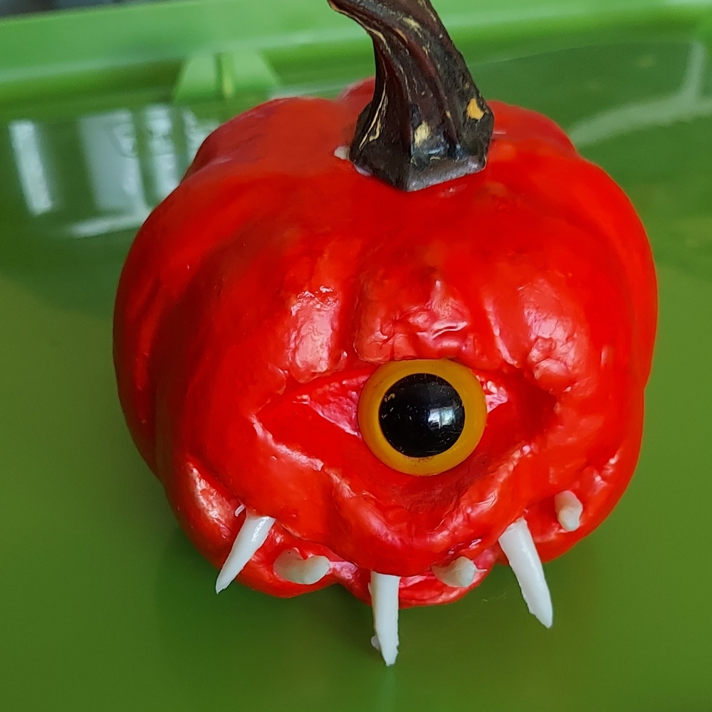 Small pumpkin cyclops with fangs teeth Halloween